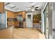 Bright kitchen featuring natural wood cabinets, stainless steel appliances, and sliding glass doors at 663 Serramonte Dr, Marietta, GA 30068