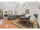 Spacious living and dining area with hardwood floors, comfortable seating, and stone fireplace at 663 Serramonte Dr, Marietta, GA 30068