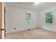 Cozy bedroom with two windows providing natural light and white walls at 1774 Willis Mill Rd, Atlanta, GA 30311