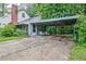 Covered carport featuring a patio area with outdoor seating, perfect for entertaining guests at 1774 Willis Mill Rd, Atlanta, GA 30311