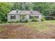 Cozy one-story home featuring classic architecture and a lush, tree-filled yard at 1774 Willis Mill Rd, Atlanta, GA 30311