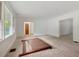 Bright living room featuring large windows, neutral carpet and white walls at 1774 Willis Mill Rd, Atlanta, GA 30311