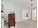 Inviting living room showcases a wooden side table, large windows and an open doorway at 1774 Willis Mill Rd, Atlanta, GA 30311