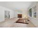 Spacious living room featuring a cozy fireplace, large windows and classic trim at 1774 Willis Mill Rd, Atlanta, GA 30311