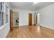 Bright living room features hardwood floors and multiple windows, perfect for natural light at 1774 Willis Mill Rd, Atlanta, GA 30311