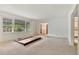 Bright living room featuring large windows, neutral carpet and white walls at 1774 Willis Mill Rd, Atlanta, GA 30311