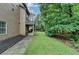 Well-maintained backyard with green lawn and landscaping, providing a serene outdoor space at 2612 Back Creek Chase, Dacula, GA 30019