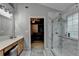 This bathroom features a glass shower and a marble surround at 2612 Back Creek Chase, Dacula, GA 30019