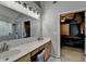 This bathroom has a double vanity and a shower with marble surround at 2612 Back Creek Chase, Dacula, GA 30019