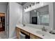 This bathroom has a double vanity, a large mirror, and a marble shower at 2612 Back Creek Chase, Dacula, GA 30019