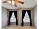 Cozy bedroom with soft carpet, natural light from double windows, and ceiling fan at 2612 Back Creek Chase, Dacula, GA 30019