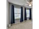 Bedroom with carpet, two windows providing natural light and ceiling fan at 2612 Back Creek Chase, Dacula, GA 30019