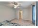 Bedroom with neutral walls, and light from a window near the bed at 2612 Back Creek Chase, Dacula, GA 30019