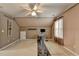 Spacious bedroom with carpet, fan, neutral paint, and exercise equipment at 2612 Back Creek Chase, Dacula, GA 30019