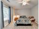Bedroom with carpet, a ceiling fan, and natural light coming through the window at 2612 Back Creek Chase, Dacula, GA 30019