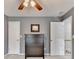 Bedroom with soft carpet, neutral paint, ceiling fan, and easy access to other parts of the house at 2612 Back Creek Chase, Dacula, GA 30019