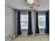 Carpeted bedroom featuring windows, fan, and neutral paint at 2612 Back Creek Chase, Dacula, GA 30019