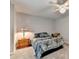 Primary bedroom with a patterned duvet, side table and lamp at 2612 Back Creek Chase, Dacula, GA 30019