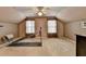 Spacious carpeted bonus room with exercise equipment, windows, and a ceiling fan at 2612 Back Creek Chase, Dacula, GA 30019