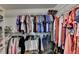 Walk-in closet with a closet system and rods and shelves for storage at 2612 Back Creek Chase, Dacula, GA 30019