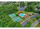 Aerial view of a community pool, tennis courts, and clubhouse, highlighting the neighborhood's recreational facilities at 2612 Back Creek Chase, Dacula, GA 30019