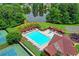 Aerial view of the community pool, lake and tennis courts, showcasing the neighborhood's recreational amenities at 2612 Back Creek Chase, Dacula, GA 30019