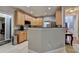 Kitchen featuring an open layout, stainless steel appliances, wood cabinets, and granite countertops at 2612 Back Creek Chase, Dacula, GA 30019