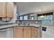 Kitchen offers stainless steel appliances, wood cabinets, and a breakfast bar overlooking the dining area at 2612 Back Creek Chase, Dacula, GA 30019