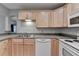 Cozy kitchen featuring wood cabinets and modern appliances at 2612 Back Creek Chase, Dacula, GA 30019