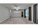 Spacious living room with gray carpet, natural light, and neutral paint at 2612 Back Creek Chase, Dacula, GA 30019