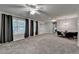 Spacious living room featuring natural light, gray carpet, and dining space at 2612 Back Creek Chase, Dacula, GA 30019