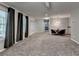 Large living room with gray carpet, large windows, and dining space at 2612 Back Creek Chase, Dacula, GA 30019