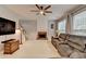 Spacious living room with a cozy fireplace and plenty of natural light at 2612 Back Creek Chase, Dacula, GA 30019