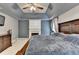 Main bedroom featuring a fireplace, trey ceiling, and a TV at 2612 Back Creek Chase, Dacula, GA 30019