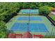 Aerial view of well-maintained tennis courts, offering recreational opportunities within the community at 2612 Back Creek Chase, Dacula, GA 30019