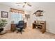 Bright bedroom featuring a desk and ceiling fan, offering a comfortable workspace at 237 Lamplighter Ln, Marietta, GA 30067