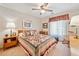 Comfortable bedroom with carpet, a quilt bedspread, two lamps, and a window with natural light at 237 Lamplighter Ln, Marietta, GA 30067