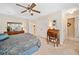 Bedroom with a large bed, dresser, and walk-in closet, offering ample storage at 237 Lamplighter Ln, Marietta, GA 30067