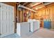 Functional laundry room with washer, dryer, freezer, and ample storage space at 237 Lamplighter Ln, Marietta, GA 30067