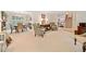 Spacious living area with elegant furnishings, a dining space, and staircase at 237 Lamplighter Ln, Marietta, GA 30067