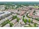 This aerial shot features a community with lots of trees and nearby shopping at 4588 Pine Se St, Smyrna, GA 30080
