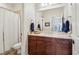 Bathroom vanity with a light countertop, wood cabinets and a shower with curtain at 4588 Pine Se St, Smyrna, GA 30080