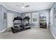 Spacious exercise room with modern treadmills and organized storage shelves at 4588 Pine Se St, Smyrna, GA 30080