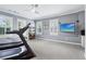Bright exercise room with a treadmill, fan, and large windows for natural light at 4588 Pine Se St, Smyrna, GA 30080