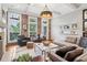 Comfortable living room featuring exposed brick wall, an area rug, and stylish decor at 4588 Pine Se St, Smyrna, GA 30080