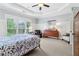 Spacious main bedroom features large windows, tray ceiling, and stylish decor at 4588 Pine Se St, Smyrna, GA 30080