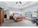 Tranquil main bedroom showcasing a trey ceiling, sitting area and an ensuite bathroom at 4588 Pine Se St, Smyrna, GA 30080