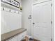 Well-organized mud room with a bench, storage, and tiled flooring at 4588 Pine Se St, Smyrna, GA 30080