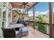 Relaxing outdoor deck with stone accents, ceiling fan, and neighborhood views at 4588 Pine Se St, Smyrna, GA 30080