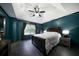 This main bedroom features a tray ceiling, dark accent walls, and large window letting in ample light at 74 Knights Ct, Dallas, GA 30157